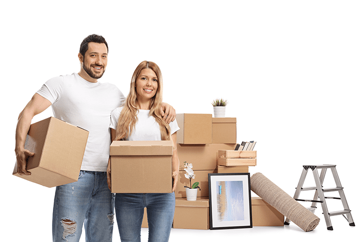 A man and woman from a residential moving service standing by a stack of packed boxes