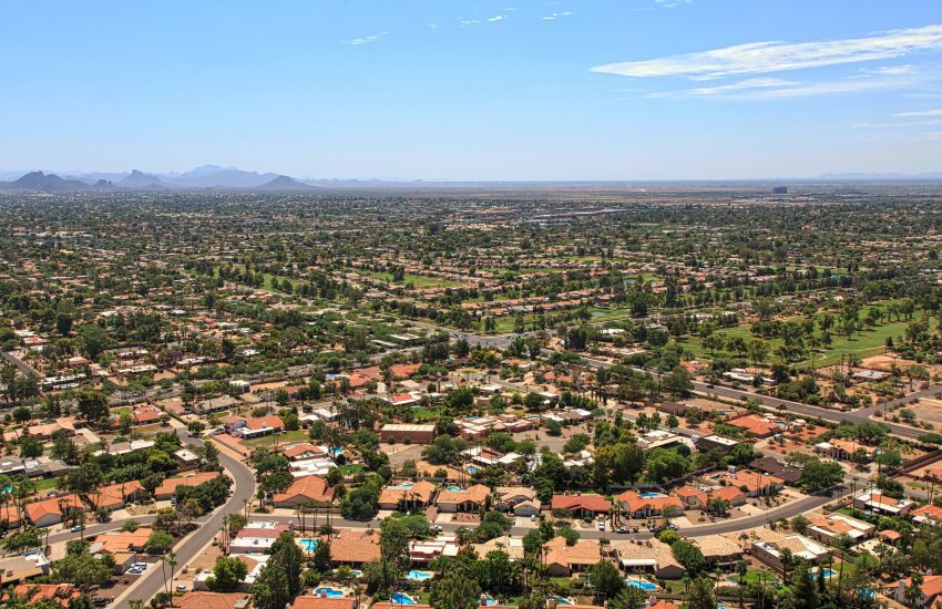 Suburban Scottsdale, Arizona skyline above rooftops, swimming pools and golf course