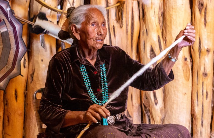 ARIZONA, USA - MARCH 29, 2020: Old Navajo woman in Navajo nation reservation at Monument Valley, Arizona, USA