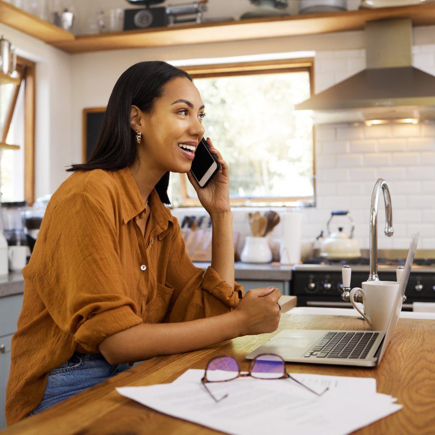 Woman, phone call and remote work with laptop, conversation and communication with technology. Female freelance employee talking, working from home with networking or telemarketing, sales and telecom