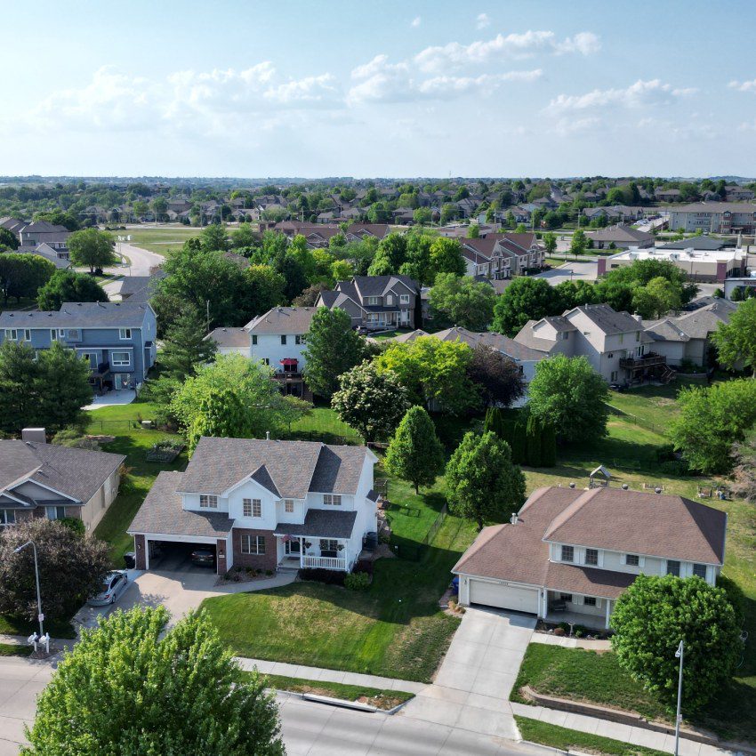 A neighborhood surrounded by trees next to the highway in Omaha, Nebraska, USA