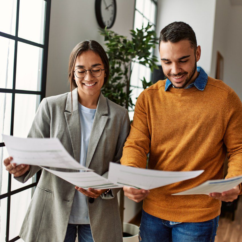 Two business workers smiling happy