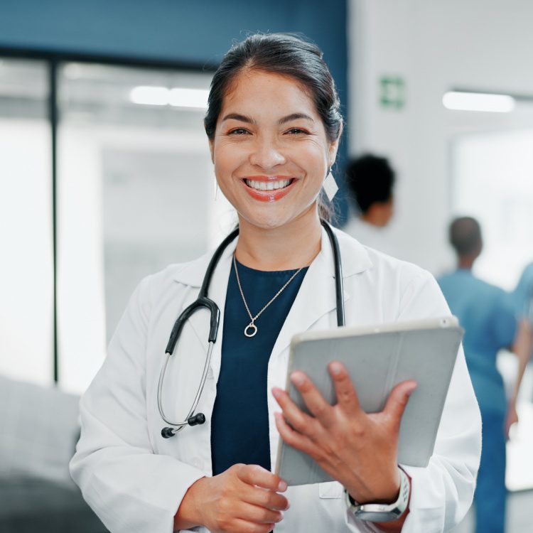 Happy woman or doctor face in busy hospital with tablet for healthcare services, leadership and career mindset. Portrait of medical professional or female on telehealth app for clinic job management