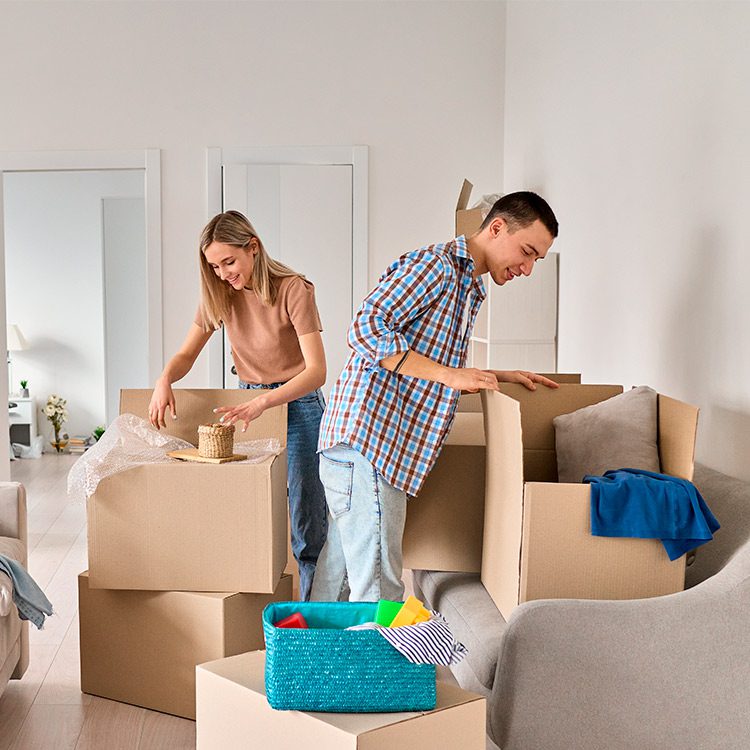 Couple doing packing for moving.