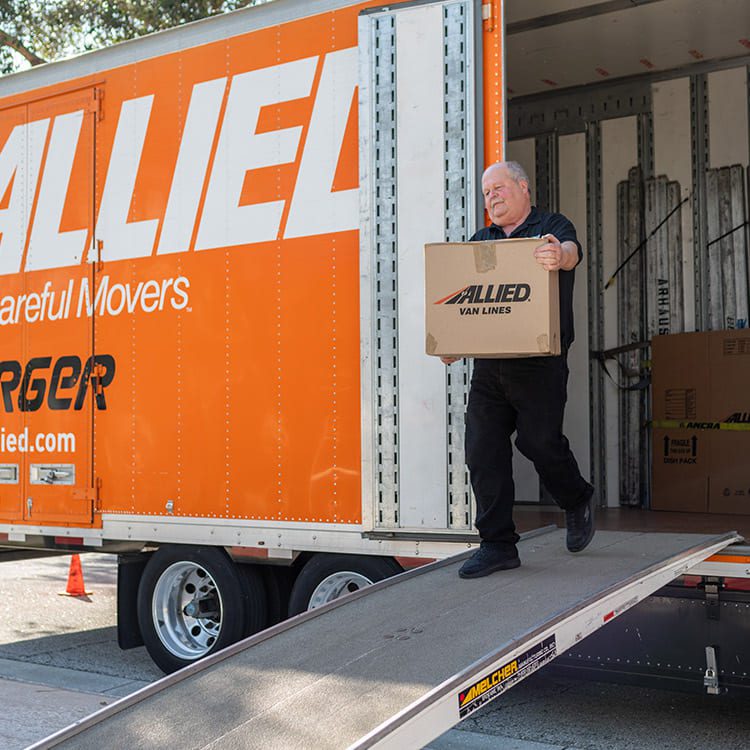 Mover from Atlas Allied with moving box in a mover truck
