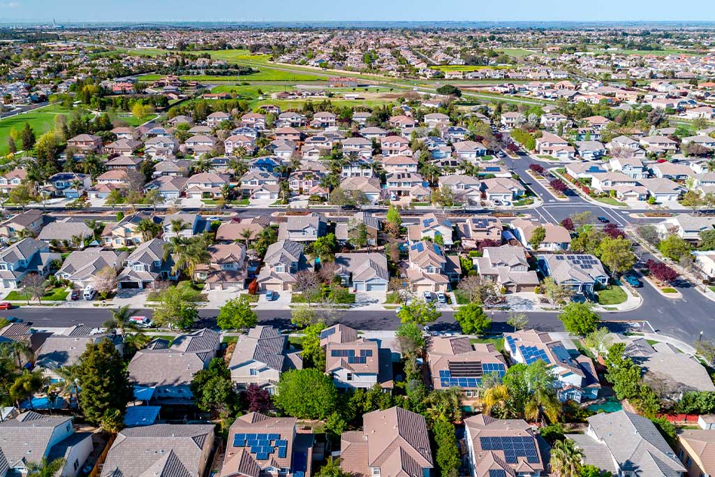 Aerial perspective of a suburban neighborhood, featuring homes and greenery, related to relocating from St Paul to Austin.