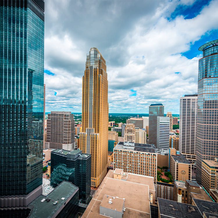 A high vantage point of Minneapolis' skyline, highlighting the city's buildings and urban environment.