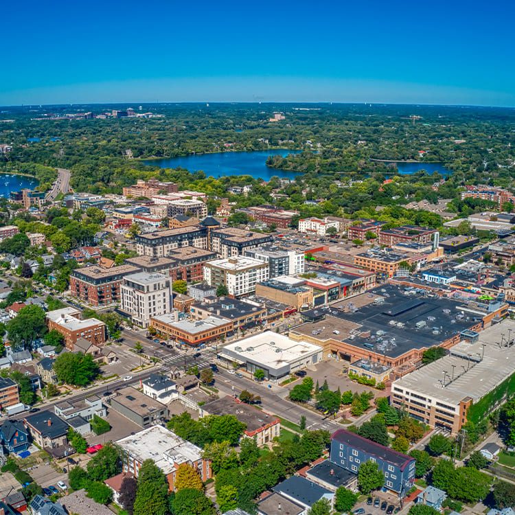 Aerial view of downtown Minneapolis showcasing skyscrapers and urban landscape, featured in a college grad relocation guide.