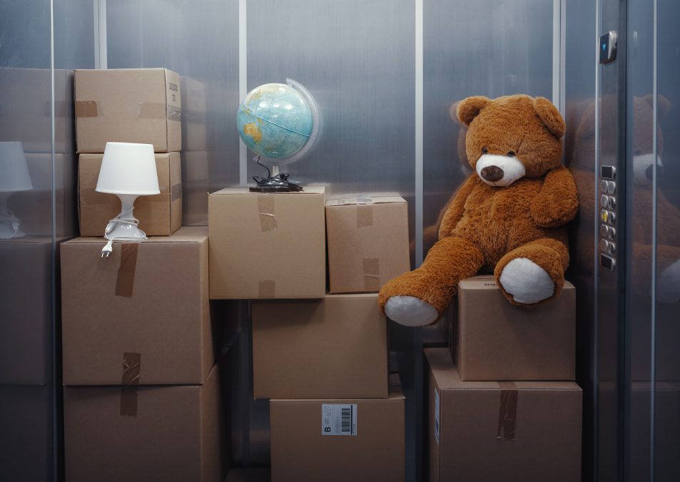 Elevator full of cardboard boxes and personal belongings, relocation concept