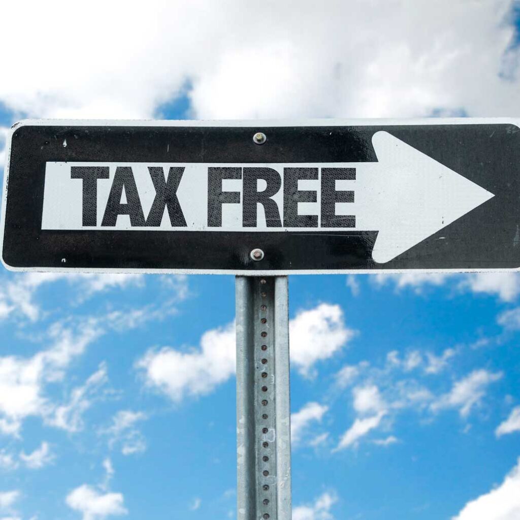 Tax Free direction sign with sky background
